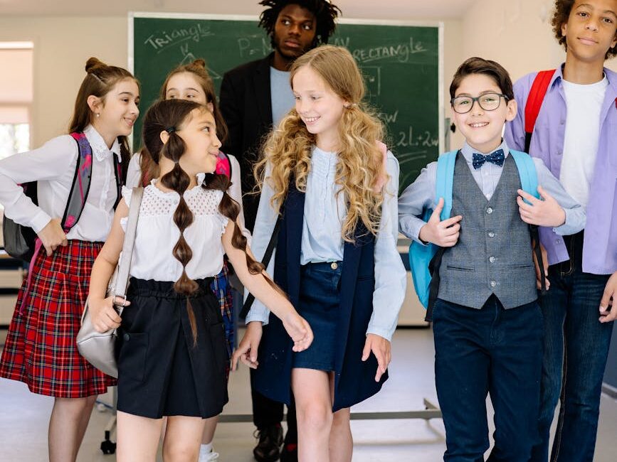 teacher with the students walking in the school