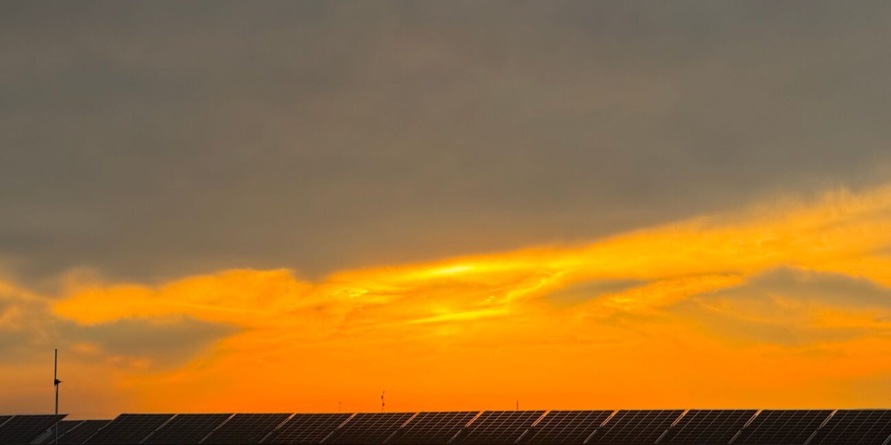 rain clouds over solar panels