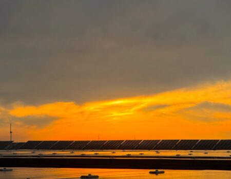 rain clouds over solar panels